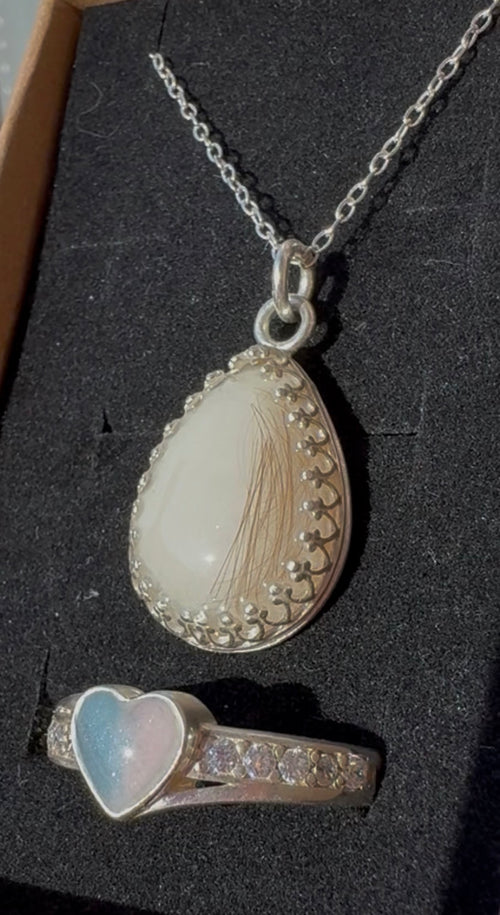 S925 teardrop crown breastmilk necklace with lock of hair and S925 heart pink and blue breastmilk ring.